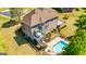 Aerial view of the home showcasing deck, swimming pool, and landscaped backyard at 325 Elderberry Trl, Fayetteville, GA 30214