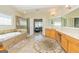 This spacious bathroom includes a walk-in shower, soaking tub, and dual vanities at 325 Elderberry Trl, Fayetteville, GA 30214