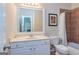 This small bathroom features a vanity sink, a toilet, and a shower/tub with tiled walls at 325 Elderberry Trl, Fayetteville, GA 30214