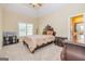 Comfortable bedroom featuring neutral walls, a ceiling fan, and ample natural light at 325 Elderberry Trl, Fayetteville, GA 30214