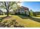 Gorgeous two-story brick home on a sprawling lawn with mature trees at 325 Elderberry Trl, Fayetteville, GA 30214
