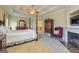 Main bedroom with a sitting area, fireplace, and walk-in closet at 325 Elderberry Trl, Fayetteville, GA 30214