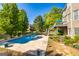 Private pool area with lush landscaping and patio, perfect for outdoor entertaining at 325 Elderberry Trl, Fayetteville, GA 30214