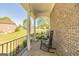 Inviting front porch with rocking chairs and brick flooring at 325 Elderberry Trl, Fayetteville, GA 30214