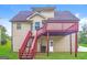 The backyard features a deck with stairs and a covered area below at 6024 S Deshon Ct, Lithonia, GA 30058