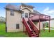 Home featuring a backyard deck and staircase from the second story at 6024 S Deshon Ct, Lithonia, GA 30058
