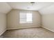 The bedroom is carpeted with a window at 6024 S Deshon Ct, Lithonia, GA 30058