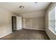 This bedroom includes a large closet and natural light from the window at 6024 S Deshon Ct, Lithonia, GA 30058