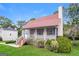 A quaint home boasting a charming screened porch, complemented by mature landscaping and a lush lawn at 6024 S Deshon Ct, Lithonia, GA 30058