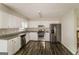 Well-appointed kitchen with stainless steel appliances, granite countertops, and updated white cabinetry at 6024 S Deshon Ct, Lithonia, GA 30058