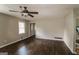 Bright living room with hardwood floors, a ceiling fan, and neutral paint, creating a serene space at 6024 S Deshon Ct, Lithonia, GA 30058