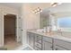 Bathroom featuring gray cabinets, granite countertops, and double sinks at 284 Villa Grande Dr, Locust Grove, GA 30248