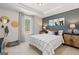 Stylishly decorated bedroom featuring a queen bed, modern furnishings, and natural light from the window at 284 Villa Grande Dr, Locust Grove, GA 30248