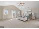 Spacious bedroom with vaulted ceilings, lots of light, ceiling fan, and neutral decor at 284 Villa Grande Dr, Locust Grove, GA 30248