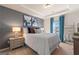 Comfortable bedroom featuring a queen bed, soft lighting, neutral carpet, and a calming color scheme at 284 Villa Grande Dr, Locust Grove, GA 30248