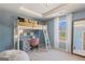 Charming bedroom with a loft bed, desk area, and large window offering natural light at 284 Villa Grande Dr, Locust Grove, GA 30248