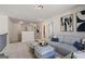Upstairs bonus area featuring neutral carpet, a sectional, and stylish decor with views to the downstairs at 284 Villa Grande Dr, Locust Grove, GA 30248