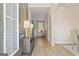 Bright entryway with hardwood floors, decor, and a glimpse into the living room at 284 Villa Grande Dr, Locust Grove, GA 30248
