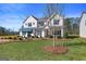 New home with a well-maintained lawn, tidy landscaping, and a pleasant neighborhood at 284 Villa Grande Dr, Locust Grove, GA 30248