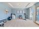 A home gym or office with a tray ceiling, three motivational posters, and great light at 284 Villa Grande Dr, Locust Grove, GA 30248