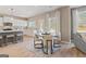 Modern kitchen and breakfast nook with white cabinets and stainless appliances at 284 Villa Grande Dr, Locust Grove, GA 30248