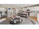 Bright kitchen with white cabinets, stainless appliances, and kitchen island at 284 Villa Grande Dr, Locust Grove, GA 30248