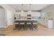 Bright kitchen with a kitchen island, stainless appliances, and bar stool seating at 284 Villa Grande Dr, Locust Grove, GA 30248