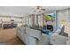 Inviting living room featuring a fireplace, TV, and open access to the kitchen at 284 Villa Grande Dr, Locust Grove, GA 30248