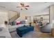 Open living area with stairs and a view of the kitchen and bar seating at 284 Villa Grande Dr, Locust Grove, GA 30248