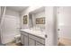 Bathroom with double sinks, neutral cabinets and tile floors at 12040 Conrad Cir, Hampton, GA 30228