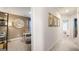 Hallway with art, leading to a study and other rooms at 12040 Conrad Cir, Hampton, GA 30228