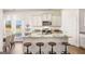 Bright kitchen featuring a central island with seating and modern appliances at 12040 Conrad Cir, Hampton, GA 30228