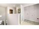 Landing area with a laundry room including shelving and tile floors at 12040 Conrad Cir, Hampton, GA 30228