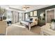 Serene primary bedroom with natural light and ample space for relaxation at 12040 Conrad Cir, Hampton, GA 30228