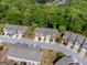 Aerial view showcases this neighborhood with well-maintained homes and mature trees at 3526 Brockenhurst Dr, Buford, GA 30519