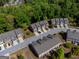 Aerial view showcases this neighborhood with well-maintained homes and mature trees at 3526 Brockenhurst Dr, Buford, GA 30519