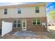 View of the home's brick and siding exterior and a patio area at 3526 Brockenhurst Dr, Buford, GA 30519