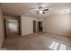 Spacious carpeted bedroom with ceiling fan, multiple doorways and natural light at 3526 Brockenhurst Dr, Buford, GA 30519