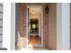 Inviting entryway featuring hardwood flooring and brick archways leading to other rooms at 3526 Brockenhurst Dr, Buford, GA 30519