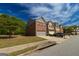 Charming townhome exterior with well-maintained lawn and attached garage at 3526 Brockenhurst Dr, Buford, GA 30519