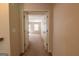 Hallway leading to a bright, carpeted room with two windows at 3526 Brockenhurst Dr, Buford, GA 30519