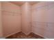 Empty walk-in closet showing three levels of wire shelving on all three walls at 3526 Brockenhurst Dr, Buford, GA 30519