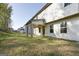 Spacious backyard featuring a covered patio area at 1144 Bluecoat Cir, Hampton, GA 30228