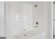Clean, bright white bathtub with shower head and temperature control at 1144 Bluecoat Cir, Hampton, GA 30228