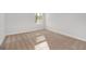 Bright bedroom with neutral carpet and white trim is illuminated by the window at 1144 Bluecoat Cir, Hampton, GA 30228