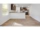 Open-concept kitchen with granite countertops and dark wood cabinets at 1144 Bluecoat Cir, Hampton, GA 30228