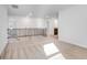 The loft features carpeted floors, white walls, and a black metal and wood banister at 1144 Bluecoat Cir, Hampton, GA 30228