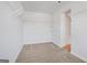 Walk-in closet with installed shelving and carpeted flooring at 1144 Bluecoat Cir, Hampton, GA 30228