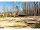 Spacious backyard with a fire pit area, offering a blank canvas for creating your own outdoor retreat at 109 Lighthorse Blvd, Mcdonough, GA 30252