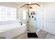 Modern bathroom featuring a glass-enclosed shower and a luxurious soaking tub at 109 Lighthorse Blvd, Mcdonough, GA 30252